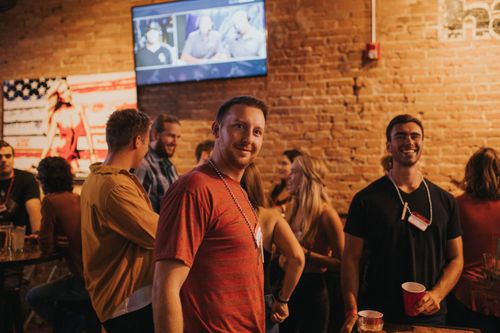 Free People enjoying a vibrant social gathering at a bar in Denver, Colorado. Stock Photo
