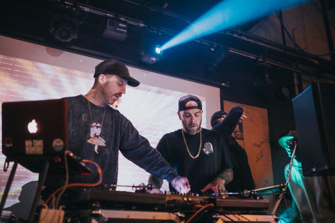 Photo of Men with Caps Performing a Live Show · Free Stock Photo