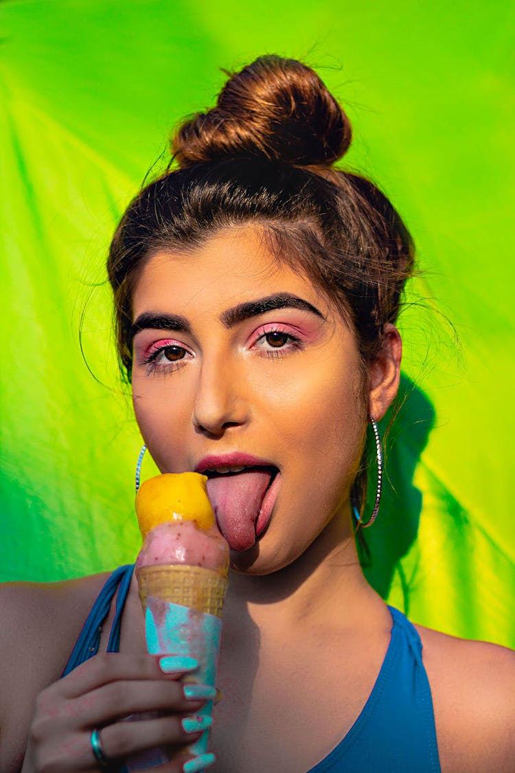 A Woman Licking An Ice Cream