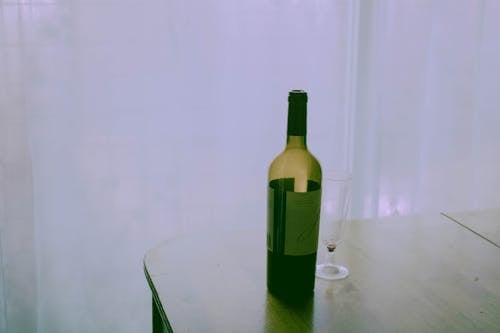 Free Wine Bottle on Table Stock Photo