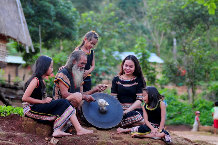 Man Holding A Gong