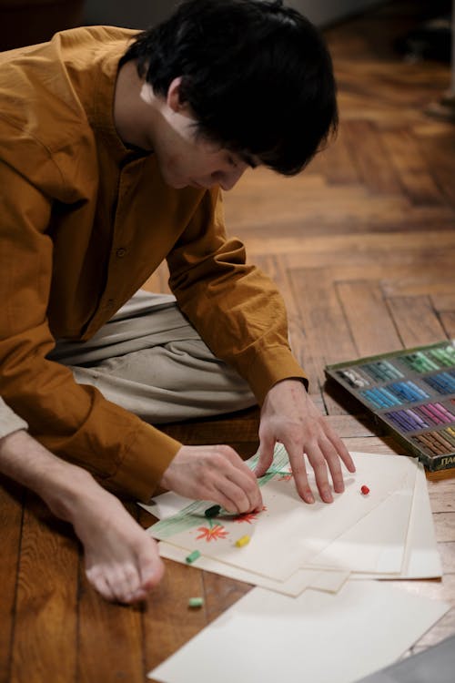 Dark Haired Man Sitting on the Floor 