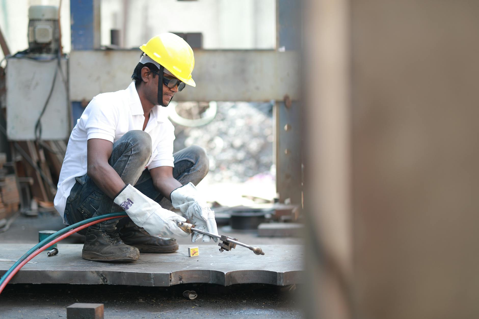 man with hard hat on working on building site