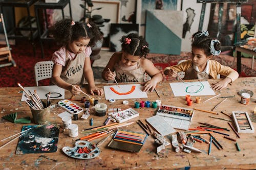 Girls Painting on a Paper