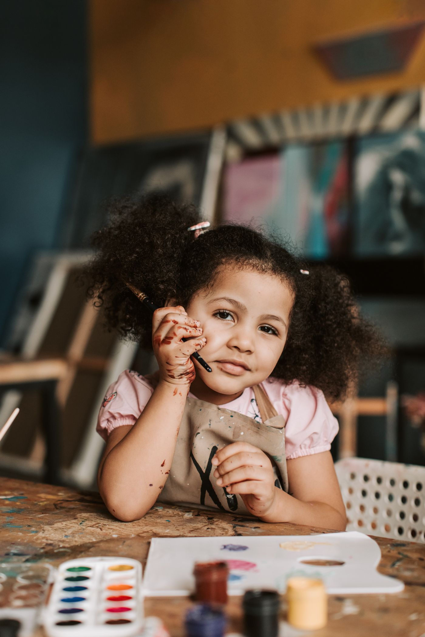 Girl painting with watercolours