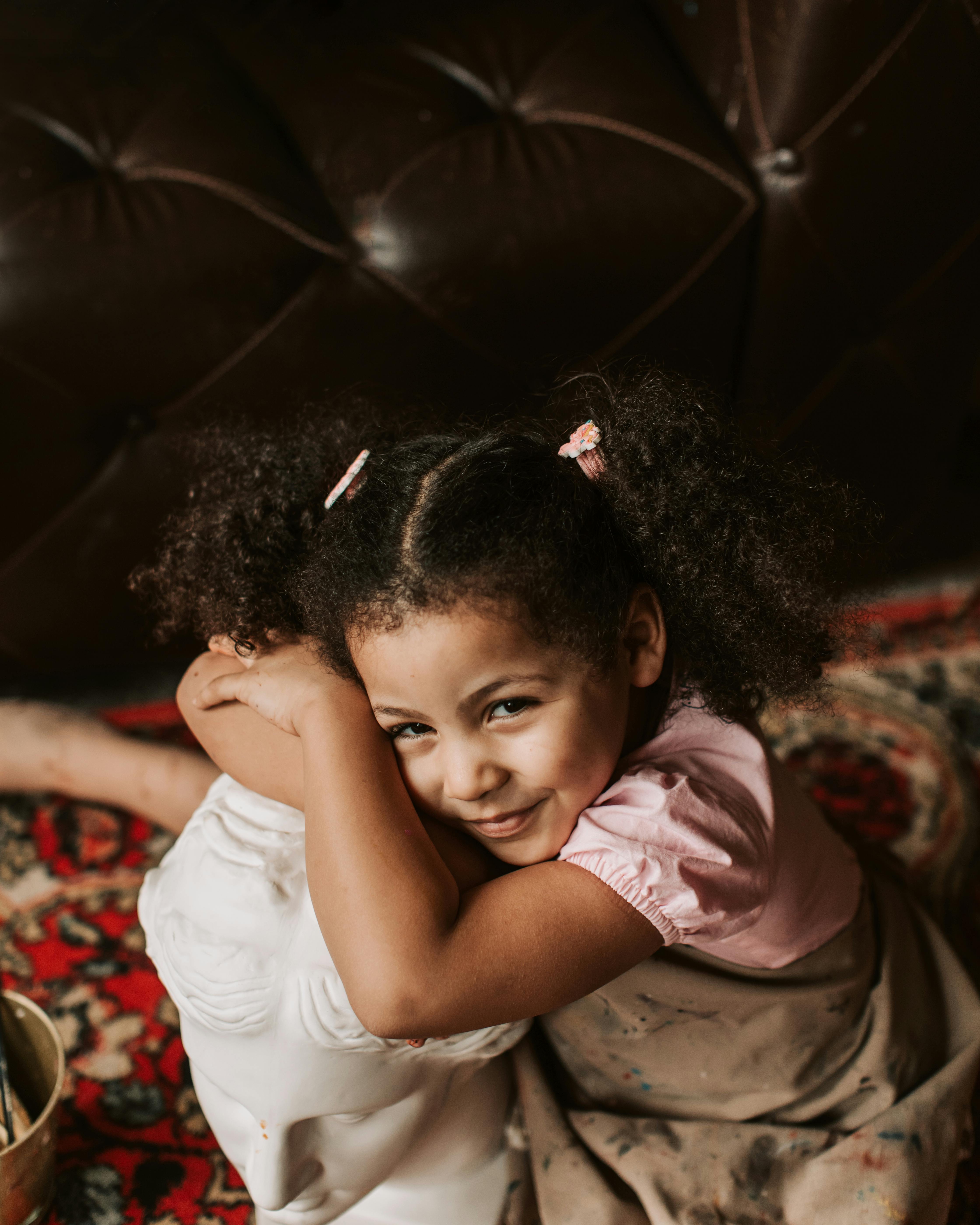 high angle shot of a child with curly hair