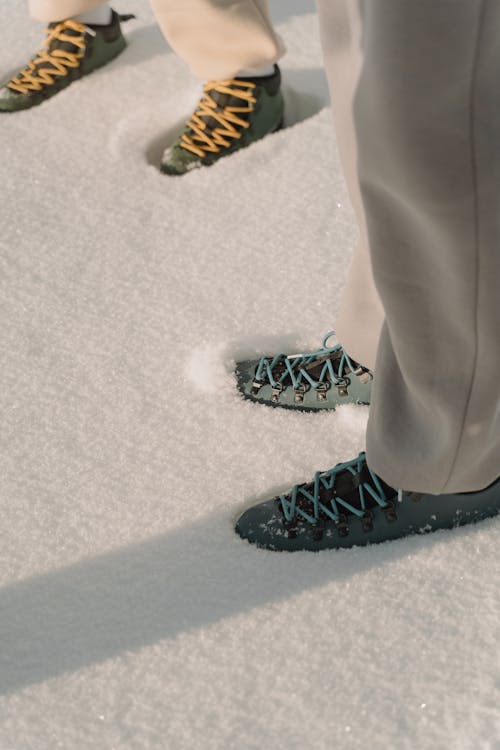 Free Photo of People's Feet on White Snow Stock Photo