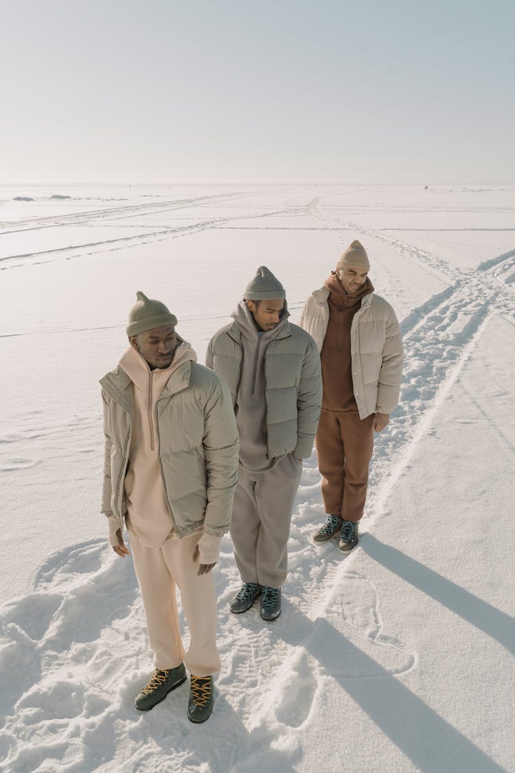 Photo Of Men In Puffer Jackets Wearing Beanies