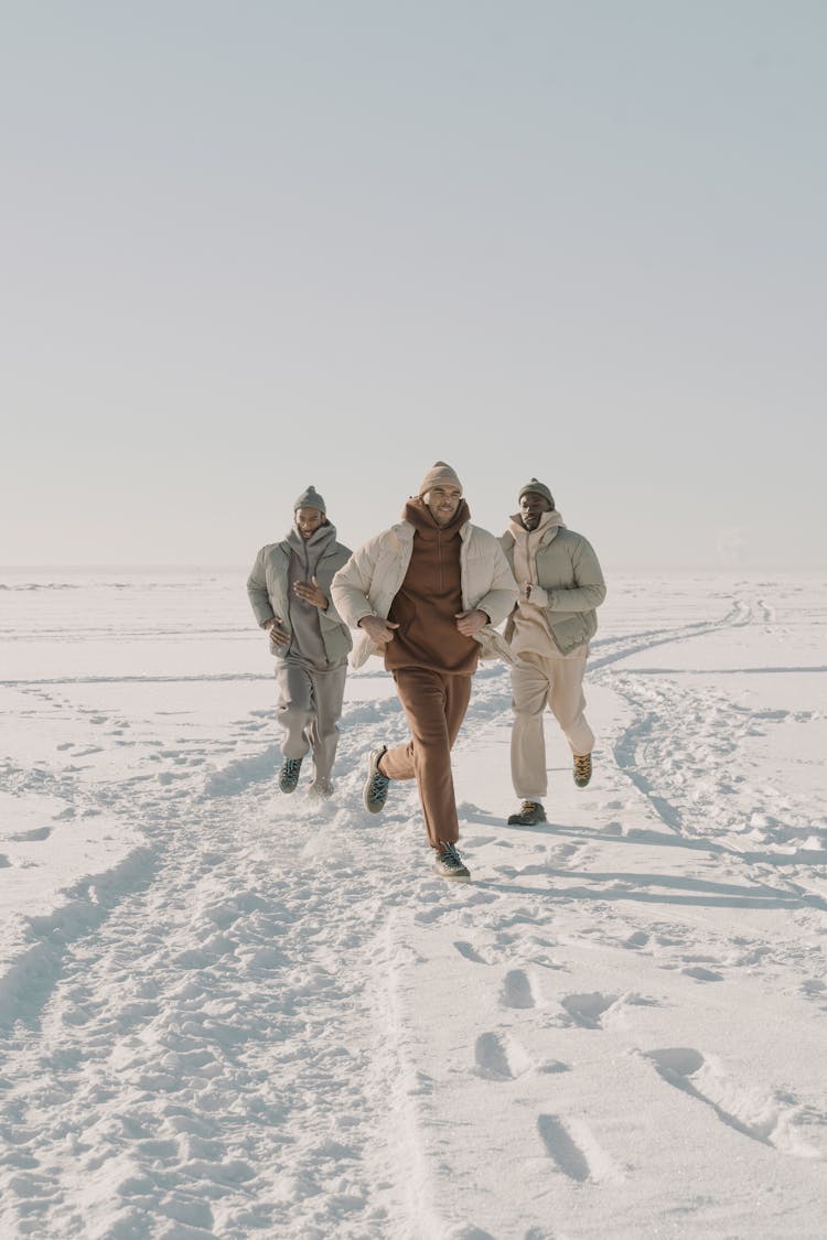 Men Running On The White Snow