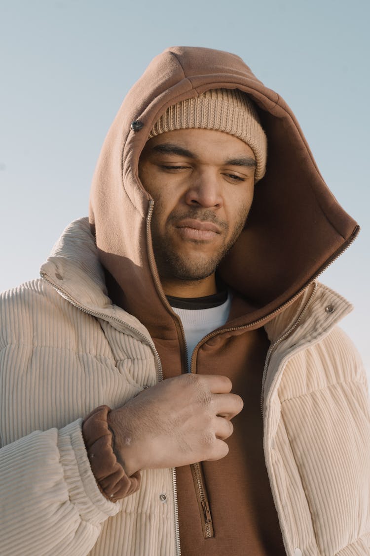 Man Holding A Zipper On His Hoodie Jacket