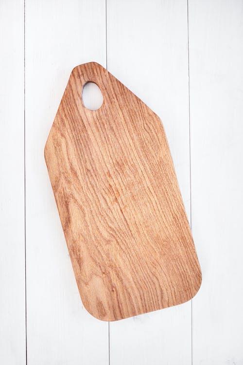 Brown Wooden Chopping Board on White Surface