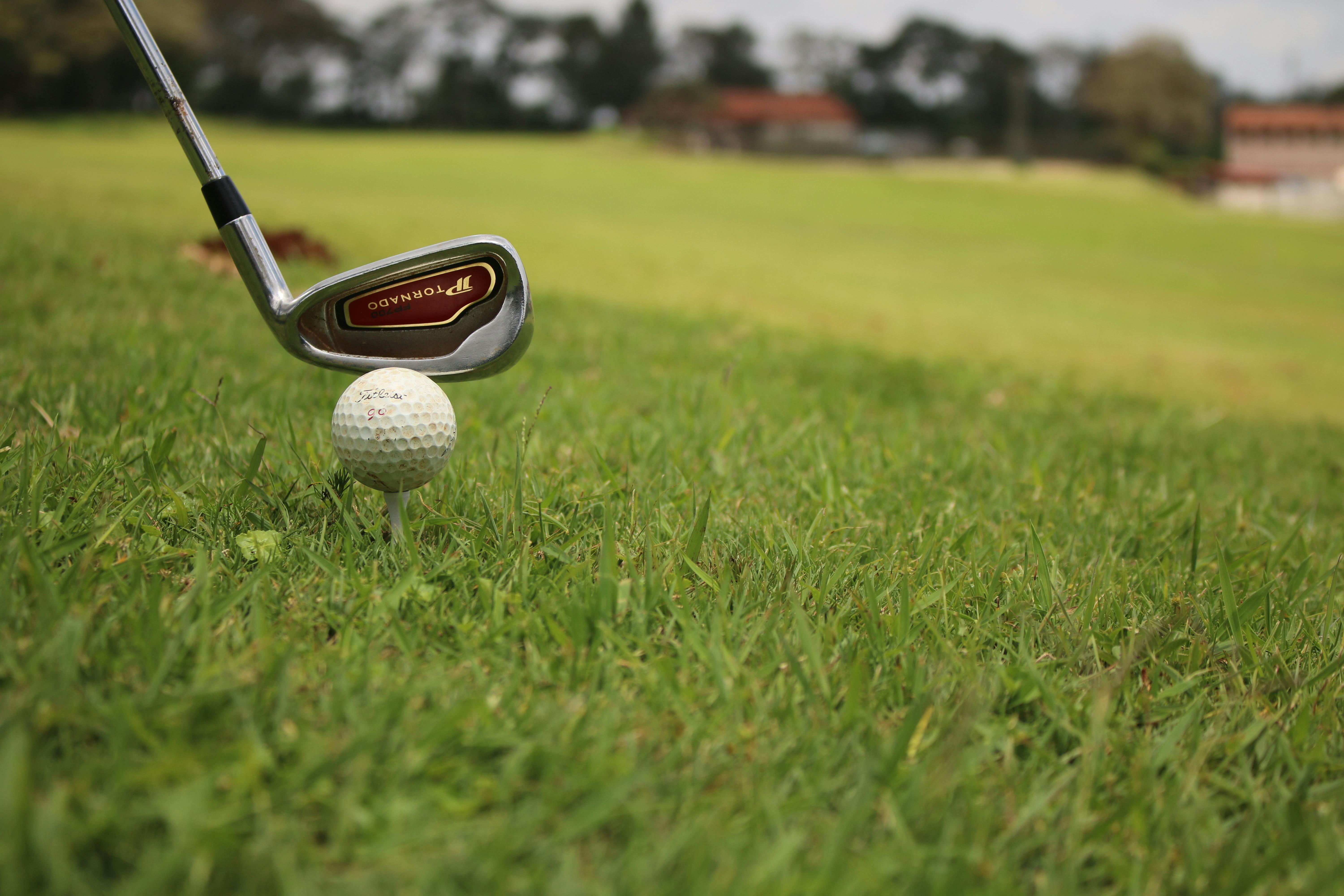 Free stock photo of Golf ball and club