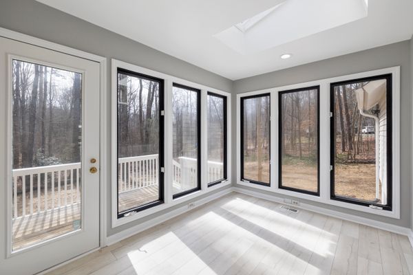 Modern floor-to-ceiling glass door for residential interiors
