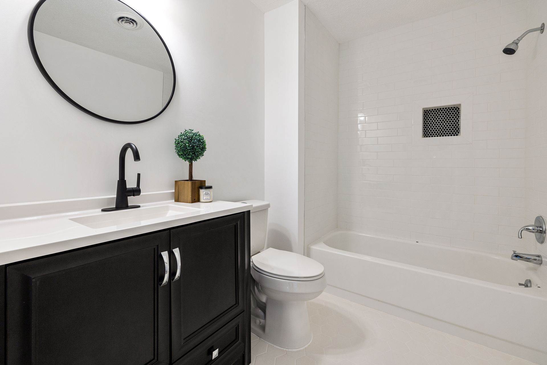 Bright and clean modern minimalist bathroom with sleek fixtures.