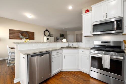 White Wooden Kitchen Cabinet and Marble Top Counter