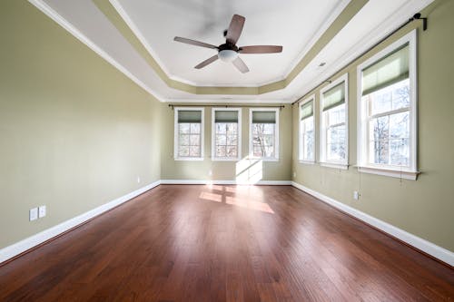 A Room of a House with a Hardwood Floor