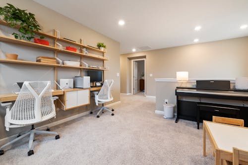 Free A Doorless Room with Wooden Shelves and Beige Rug Stock Photo