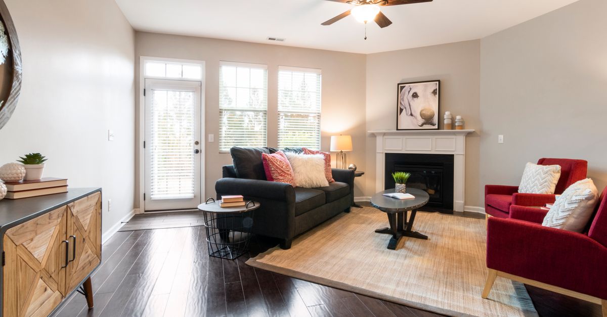 Spacious older Toronto condo living room with large windows, showing the bigger floor plans of buying an old condo vs new build