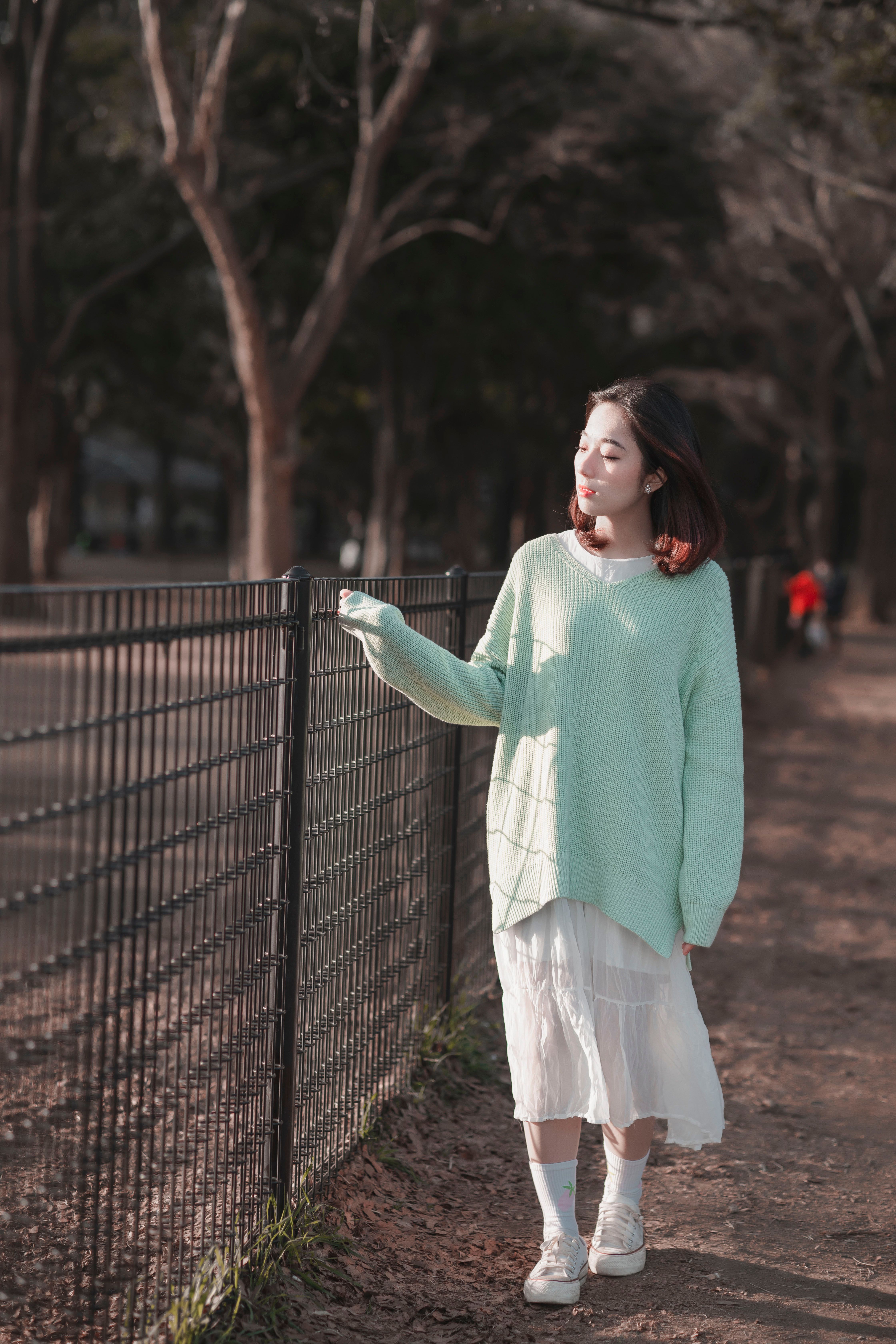 Beautiful Woman in a Knitted Sweater · Free Stock Photo