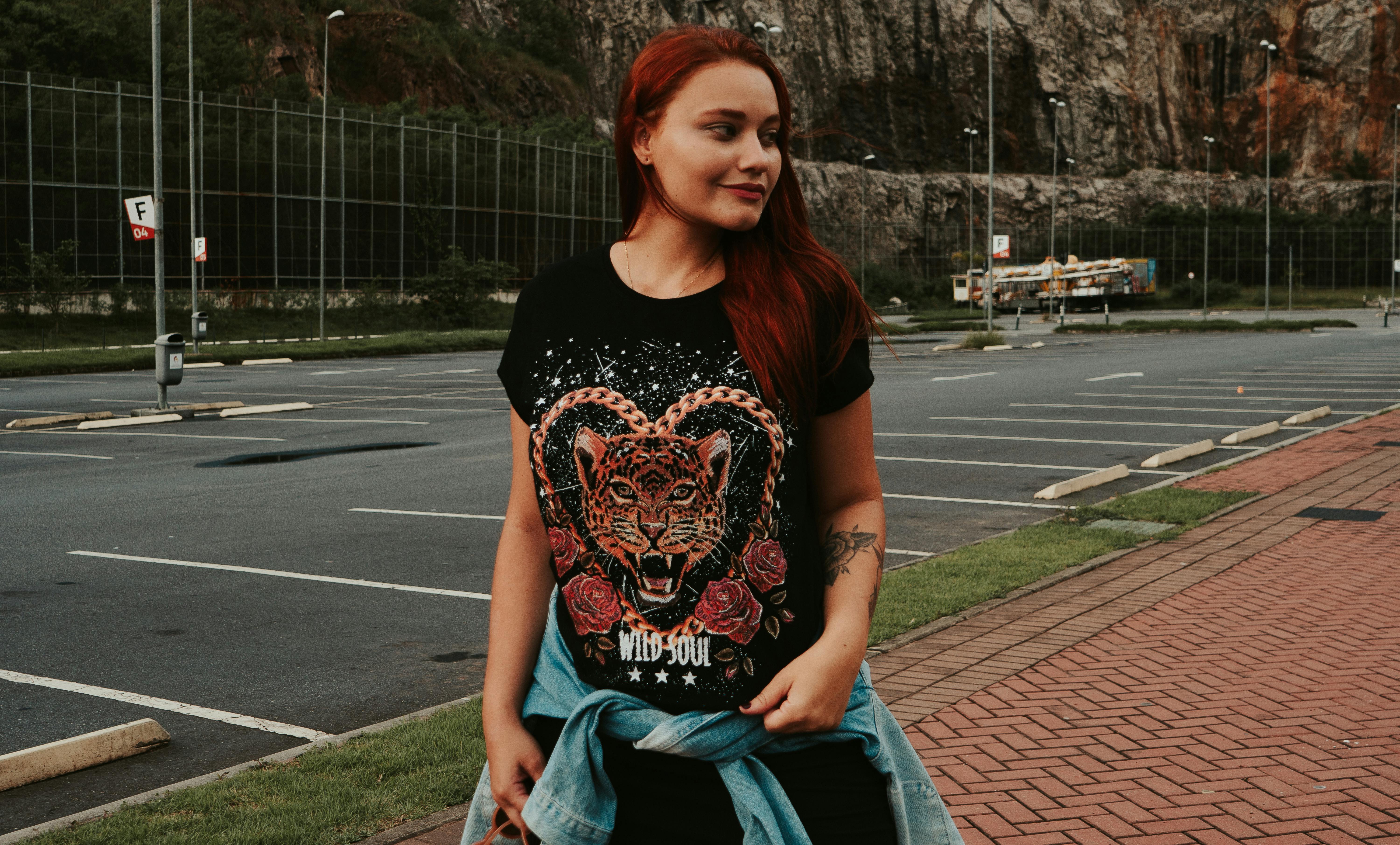 woman with red hair looking away