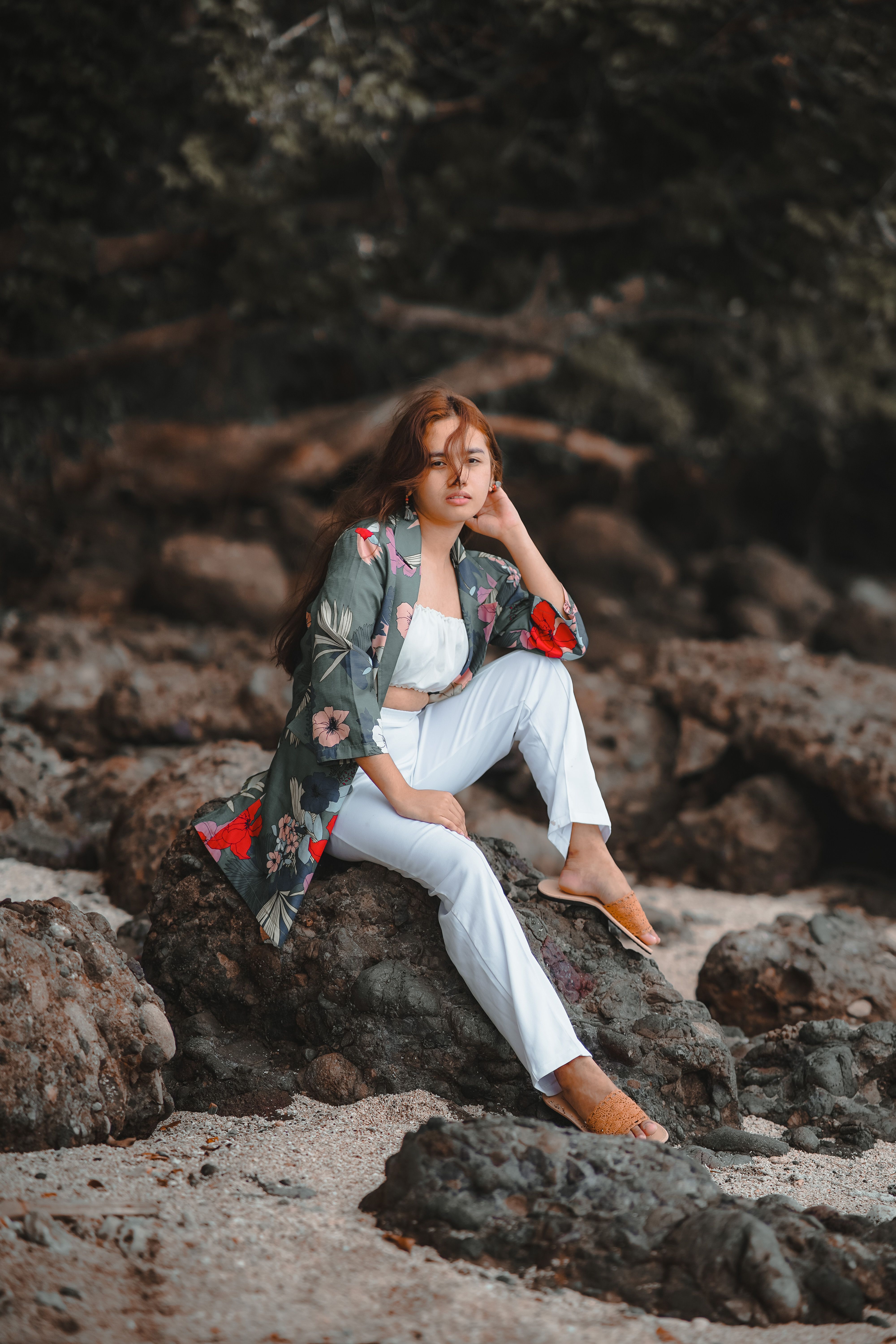 Woman in Red Top Sitting on a Water Well · Free Stock Photo