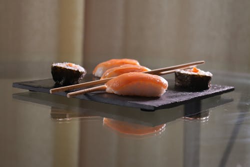 Free A Plate of Sushi with Maki and Chopsticks Stock Photo