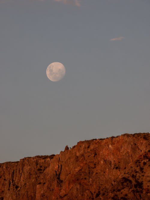 Free Brown Rocky Mountain Under the Full Moon Stock Photo
