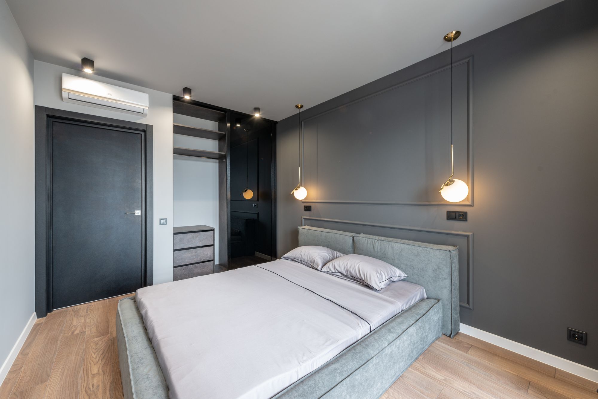 Elegant modern bedroom interior with contemporary ceiling lighting