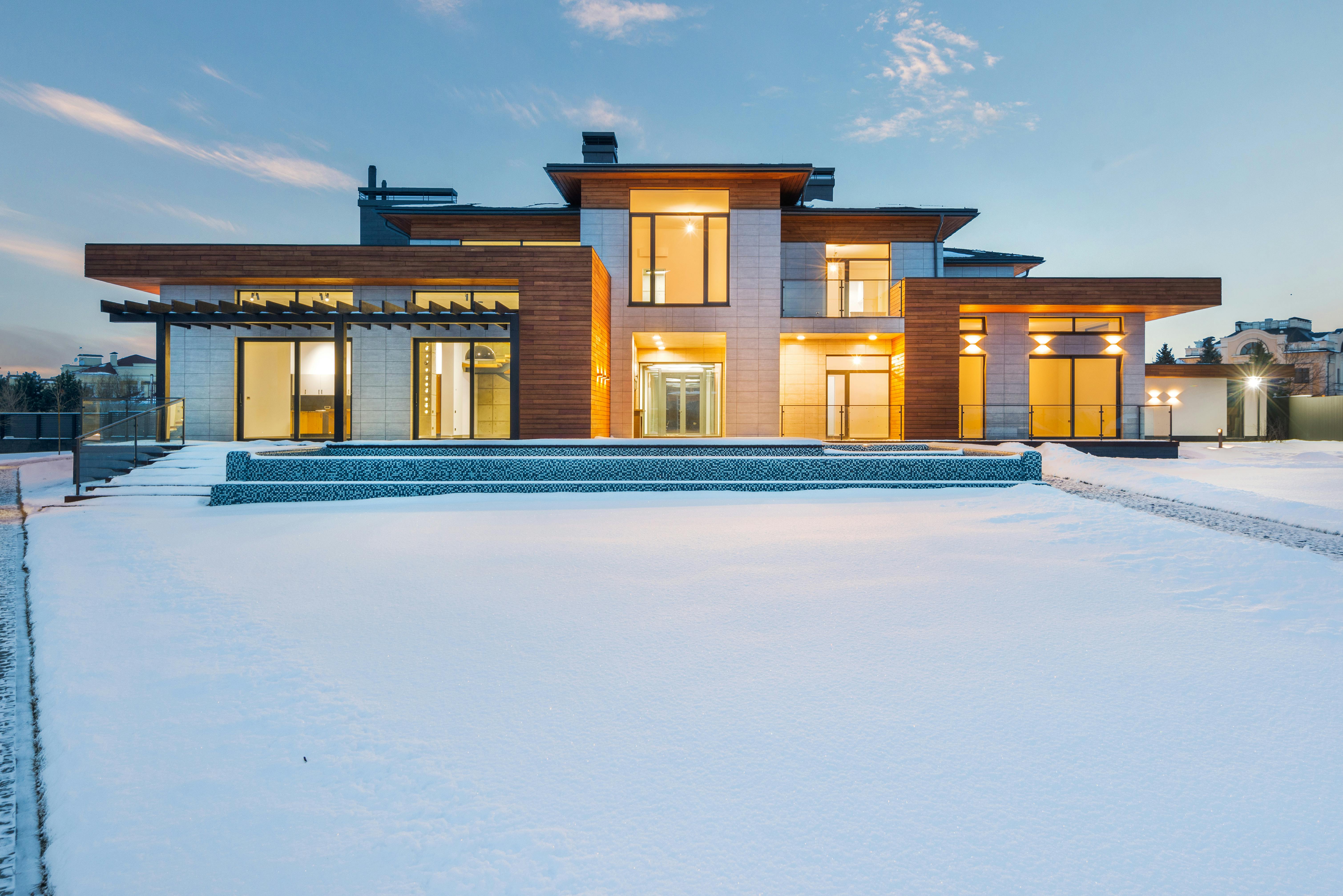 modern villa with spacious yard in winter