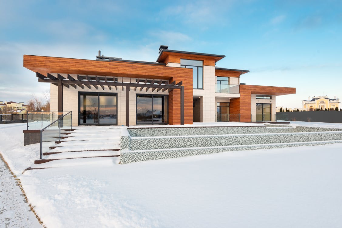 Snow covering a home’s yard