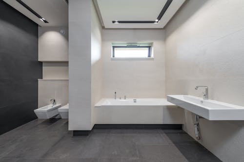 Interior of modern bathroom with white walls