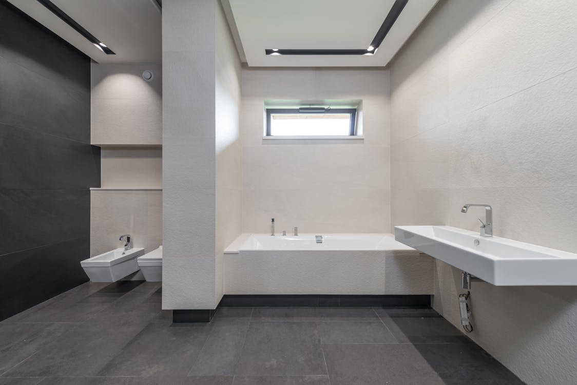 Interior of modern bathroom with white walls
