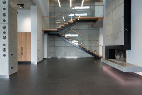 Staircase with wooden steps in spacious house