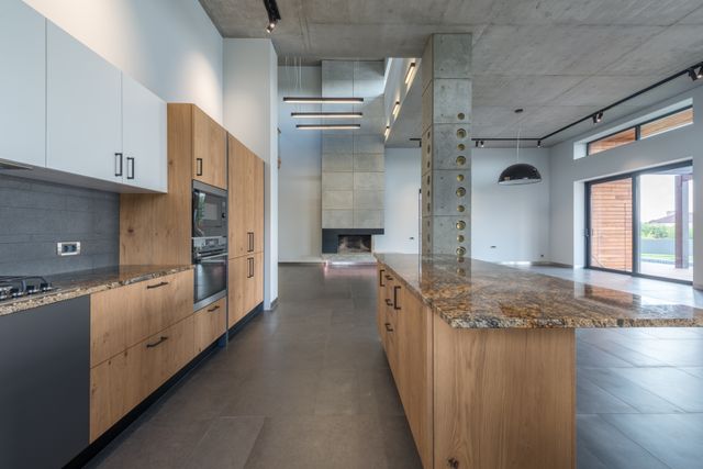 Light apartment kitchen similar to homes with Amana appliances we repair in The Colony, TX