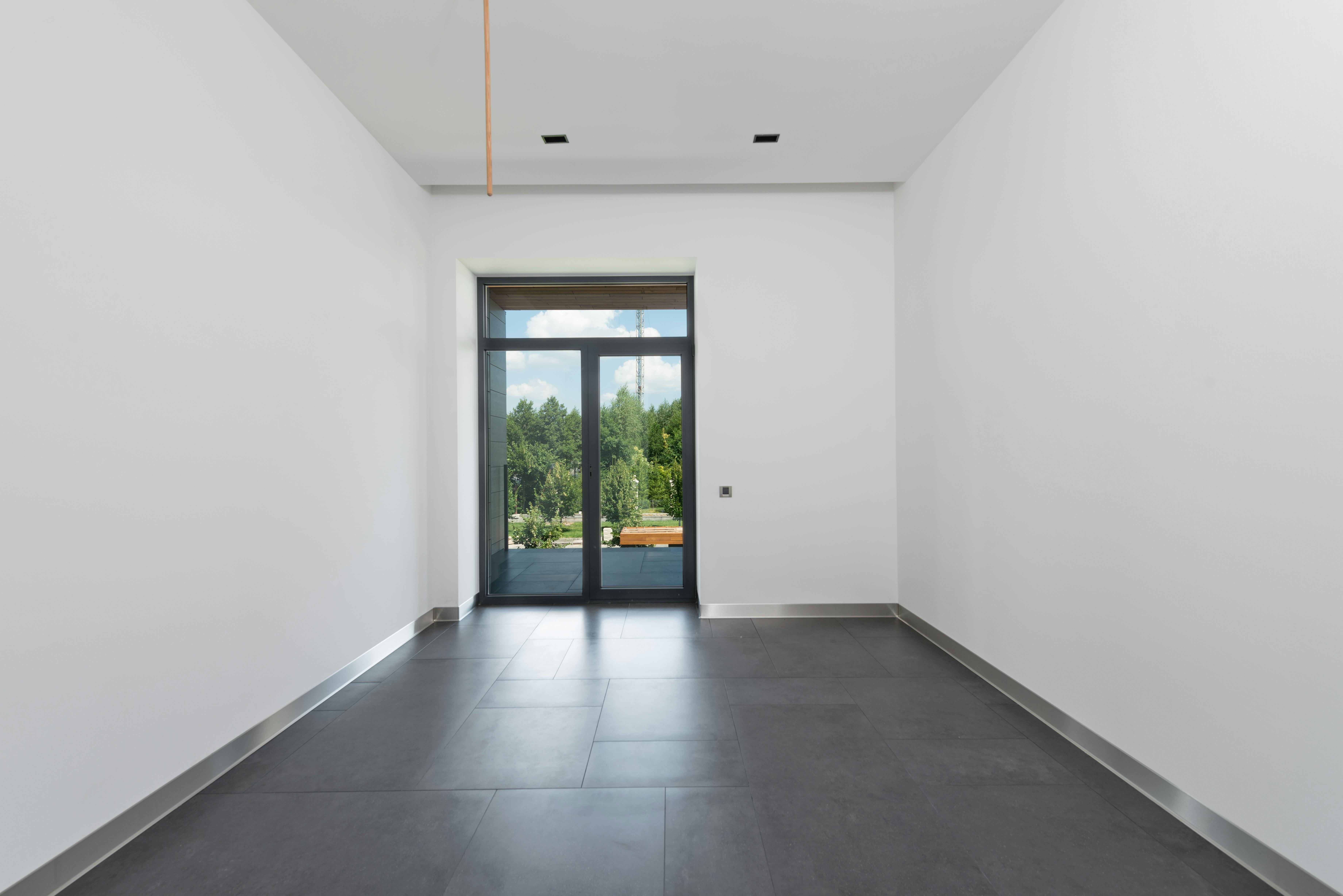 empty corridor of modern apartment with glass doors