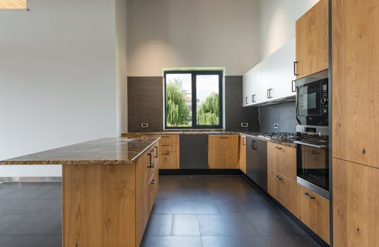 A spacious and stylish kitchen with wooden cabinets and modern appliances.