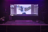 A Computer Monitor with Keyboard and Mouse on the Table