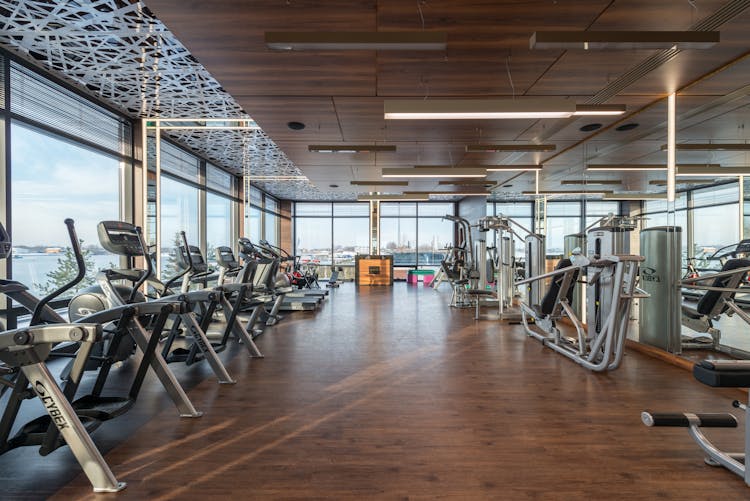 Various Fitness Machines In Modern Spacious Gym