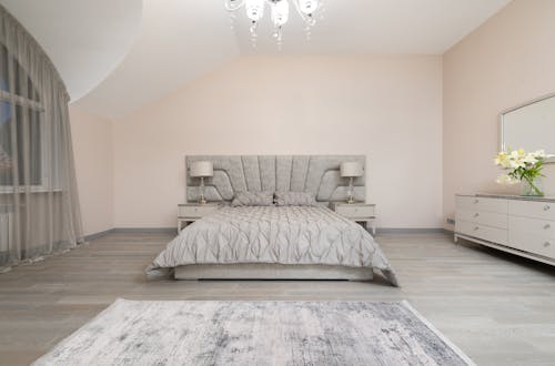 Bed with bedside tables in bedroom