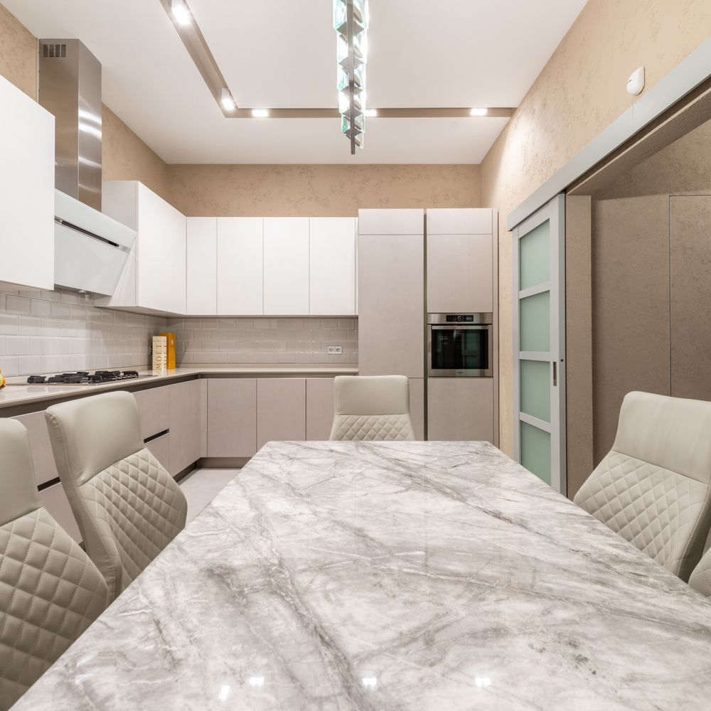 Kitchen Spraying in Aldgate — a decorator at work mid-project