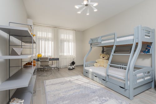 Child bedroom interior with bed and shelves