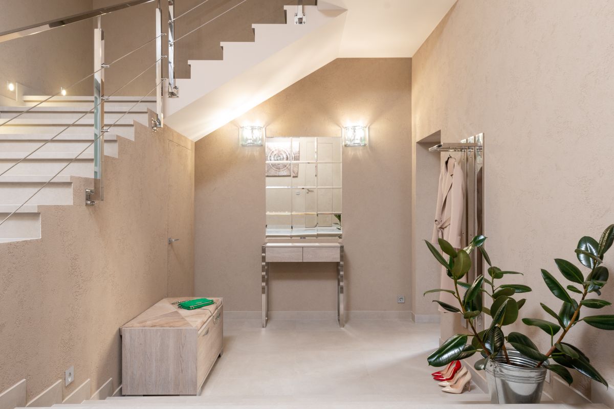 Doorway and stairs with beige walls in a modern apartment