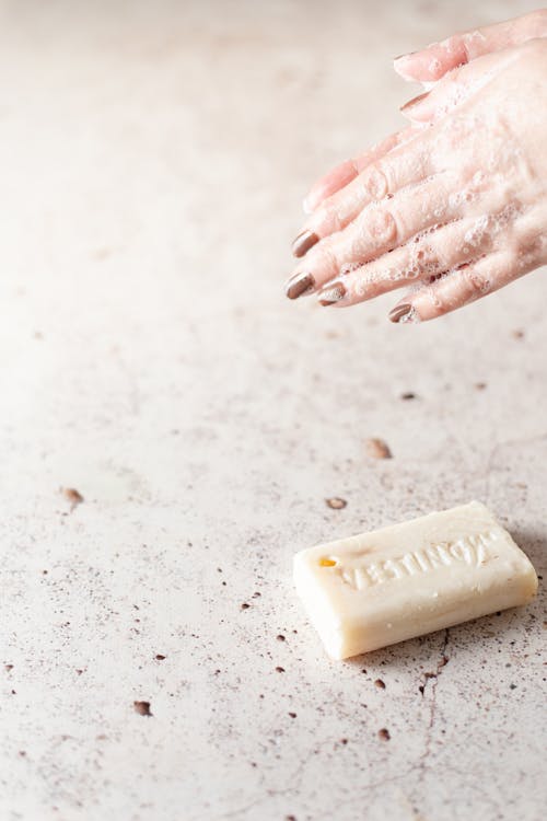 A Person Washing Hands with a Soap