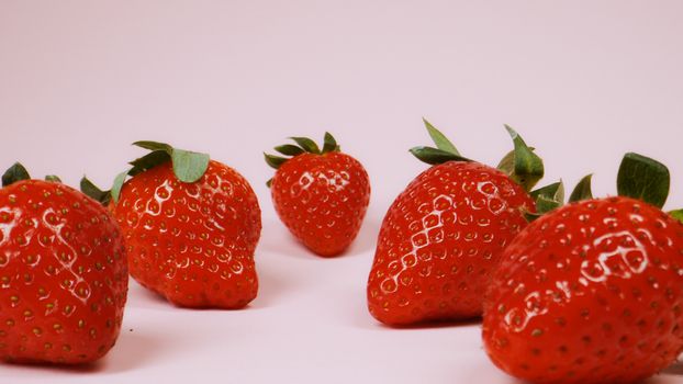 Vibrant red strawberries arranged on a soft background, showcasing freshness and appeal.
