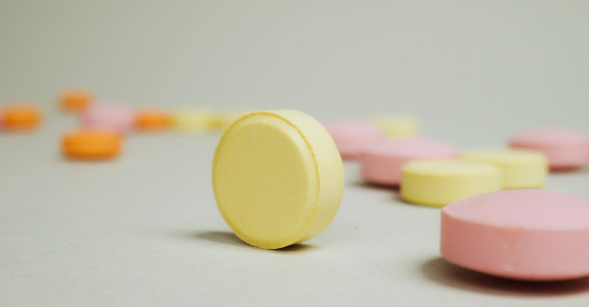 Close-up of vibrant pastel-colored candy tablets on a neutral background. - Evidence evidence guide for quercetin stress randomized trial