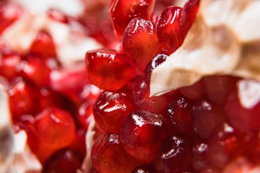 Vibrant close-up of pomegranate seeds highlighting their juicy texture and rich color.