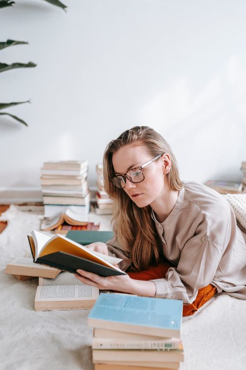 We Read Reality Transurfing So You Don'T Have To Get Lost In The Jargon 2 Woman Reading A Book Thoughtfully Surrounded By A Stack Of Books
