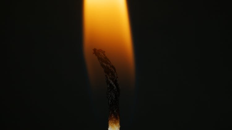 Close-Up Photo Of A Burning Candle Wick