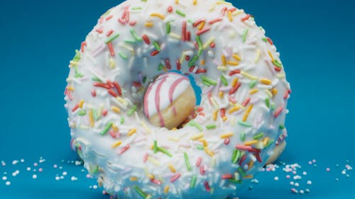 A Delicious Glazed Donut with Sprinkles in Close-up Shot