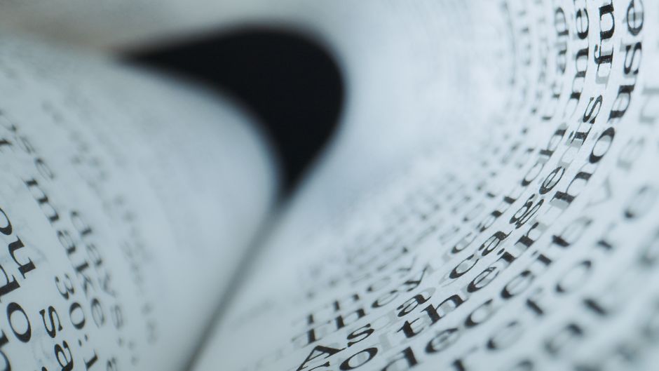 Intriguing close-up of book pages with selective focus creating a unique visual curve.